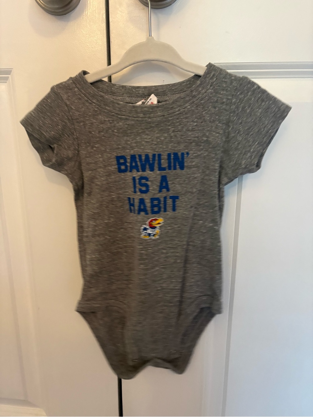 Charlie Hustle Gray Baby Onesie with Blue 'Bawlin’ Is A Habit' and Jayhawk Logo
